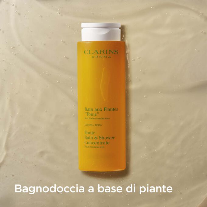 Packshot del Bagno Doccia Piante “Tonicità” Clarins con testo che sottolinea il profumo di questo gel a base di piante.